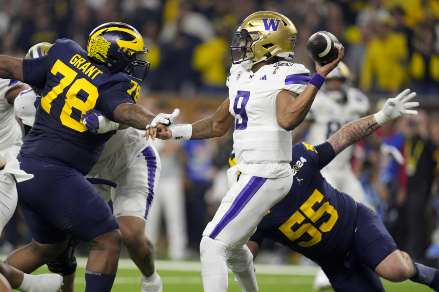 Washington quarterback Michael Penix Jr. passes against Michigan during the first half of the national championship NCAA College Football Playoff game Monday, Jan. 8, 2024, in Houston.