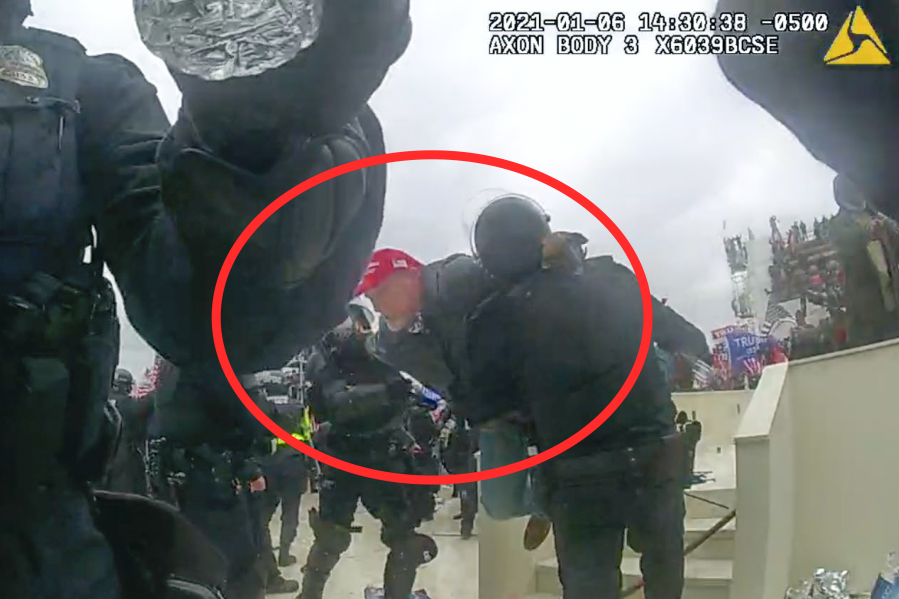This image from police body-worn camera video, and contained and annotated in the Justice Department&#039;s sentencing memorandum, shows Kenneth Bonawitz colliding with two officer at the U.S. Capitol on Jan. 6, 2021, in Washington. Bonawitz, who assaulted at least six police officers during a mob&#039;s attack on the U.S. Capitol, has been sentenced to five years in prison.