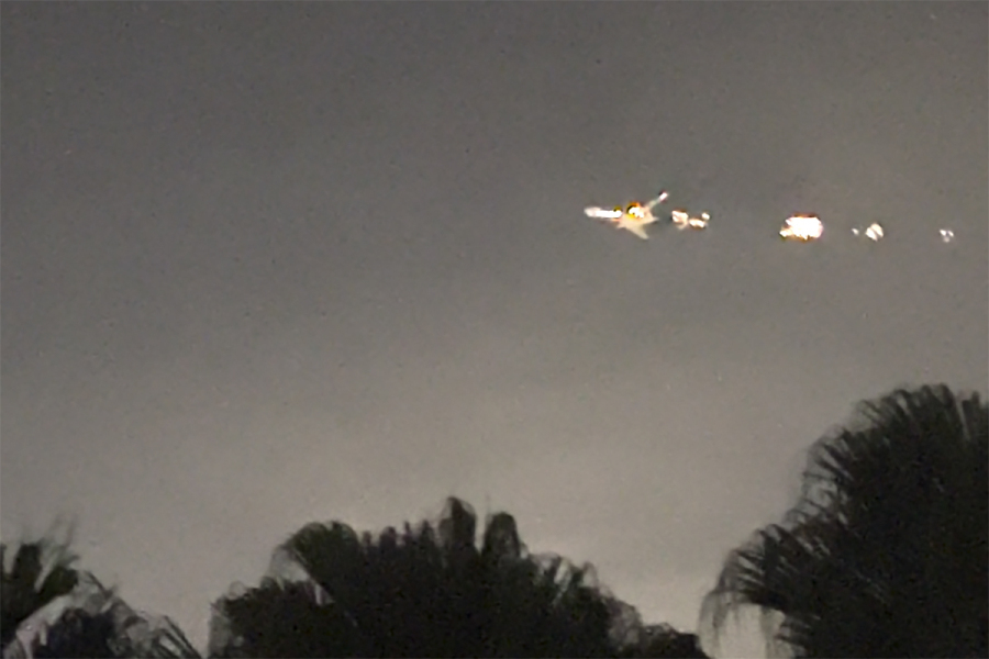 This image taken from video provided by Melanie Adaros shows   sparks shooting from a cargo plane before making an emergency landing at Miami International Airport on Thursday, Jan. 18, 2024 in Miami.  The aircraft landed safely Thursday night &ldquo;after experiencing an engine malfunction soon after departure,&rdquo; a spokesperson for Atlas Air said in a statement Friday.