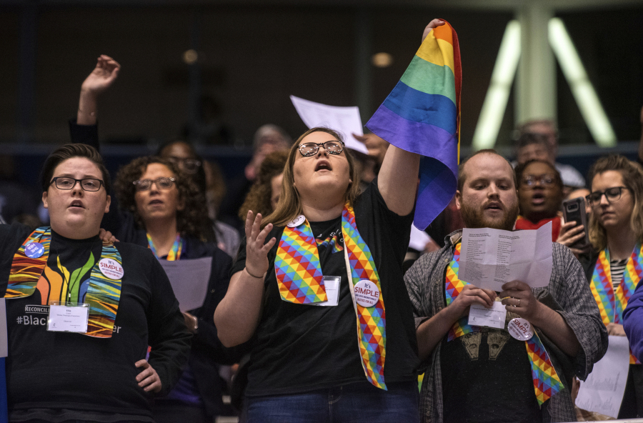 Shelby Ruch-Teegarden, center, of Garrett-Evangelical Theological Seminary, joins other protesters Feb. 26, 2019, during the United Methodist Church&rsquo;s special session of the general conference in St. Louis.