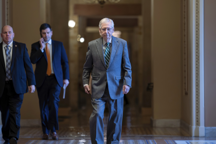 Senate Minority Leader Mitch McConnell, R-Ky., walks to the chamber at the Capitol in Washington, Thursday, Jan. 25, 2024, with bipartisan negotiations on border security unresolved. (AP Photo/J.