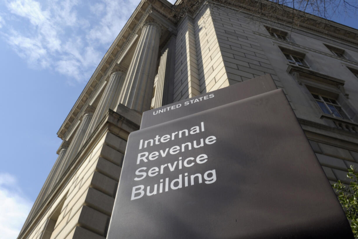 FILE - The exterior of the Internal Revenue Service (IRS) building is seen in Washington, on March 22, 2013. Congress is racing to wind down a tax break meant to encourage businesses to keep workers on the payroll during the COVID-19 pandemic. What was expected to cost the government $55 billion has instead cost it nearly five times that amount as of July. Meanwhile, new claims pour into the IRS each week.