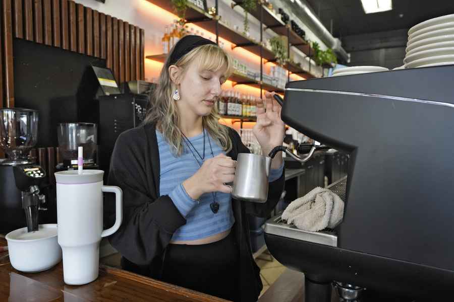Samantha Grimison makes a cup of coffee at the Blind Tiger Cafe Wednesday, Jan. 10, 2024, in Tampa, Fla.