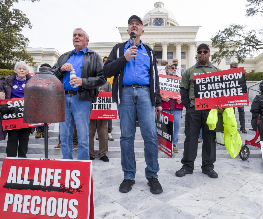 Former death row inmates who were exonerated, from left, Randall Padgent, Gary Drinkard and Ron Wright, were among the nearly one hundred protestors gathered at the state capitol building in Montgomery, Ala., on Tuesday Jan. 23, 2024, to ask Governor Kay Ivey to stop the planned execution of Kenneth Eugene Smith.