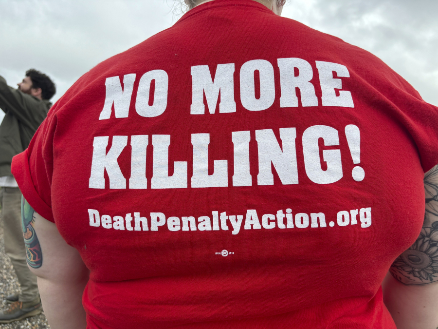 Anti-death penalty activists place signs along the road heading to Holman Correctional Facility in Atmore, Ala., ahead of the scheduled execution of Kenneth Eugene Smith on Thursday, Jan. 25, 2024. The state plans to put Smith to death with nitrogen gas, the first time the new method has been used in the United States.