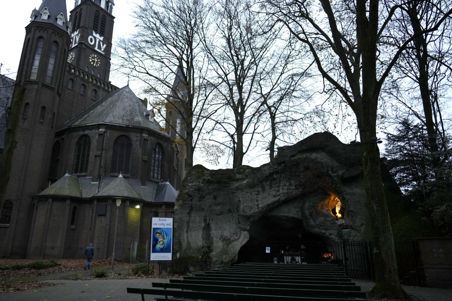 A man walks near a church grotto in Sint Willebrord, Netherlands, on Dec. 1. In this quiet Dutch village, nearly 3 out of 4 voters chose a virulently anti-migrant, anti-Muslim party in an election last year that shattered the Netherlands&rsquo; image as a welcoming, moderate country.