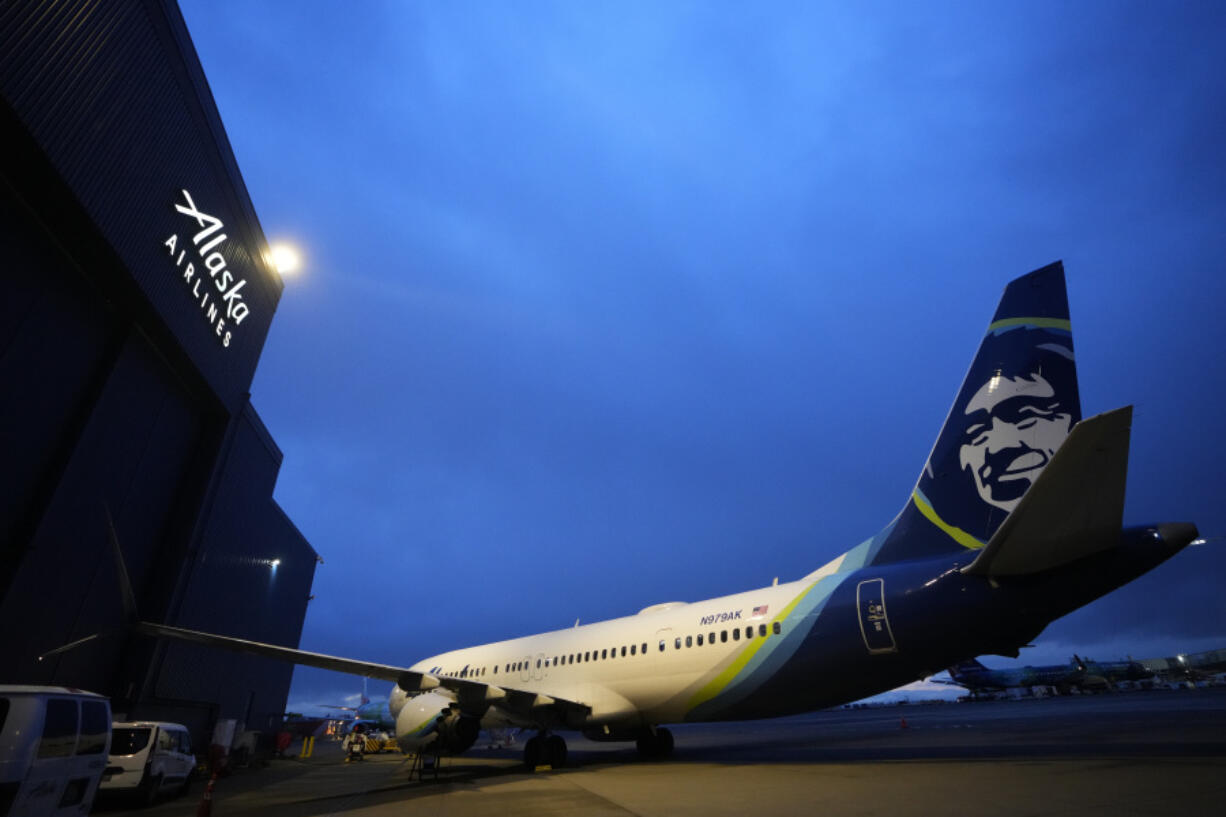 File - An Alaska Airlines Boeing 737 Max 9 aircraft awaits inspection outside the airline&rsquo;s hangar at Seattle-Tacoma International Airport Jan. 10, 2024, in SeaTac, Wash. Boeing declined to offer its own forecast of 2024 results &mdash; an indication of the uncertainty swirling around the company since a 737 Max 9 operated by Alaska Airlines suffered a midflight blowout of a panel called a door plug on Jan. 5.