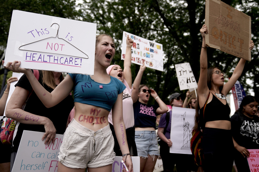 People rally in support of abortion rights on July 2, 2022, in Kansas City, Mo. A divide between abortion rights activists over whether to include restrictions related to the viability of the fetus on planned state ballot measures is roiling the movement.