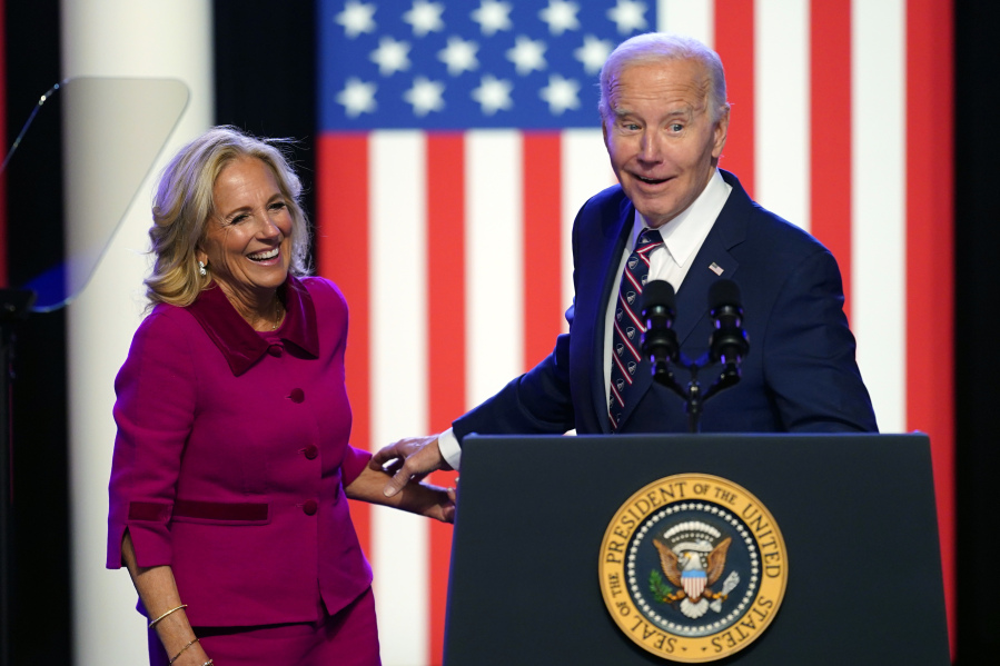 President Joe Biden and first lady Jill Biden stand on stage after Biden spoke in Blue Bell, Pa., Friday, Jan. 5, 2024.