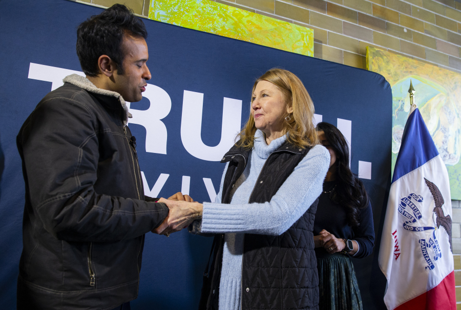 Patti Klaus of Cedar Rapids, right, talks with Republican presidential candidate Vivek Ramaswamy, left, after the &ldquo;Commit to Caucus&rdquo; event at Lion Bridge Brewing in Cedar Rapids, Iowa, Monday, Jan. 15, 2024.