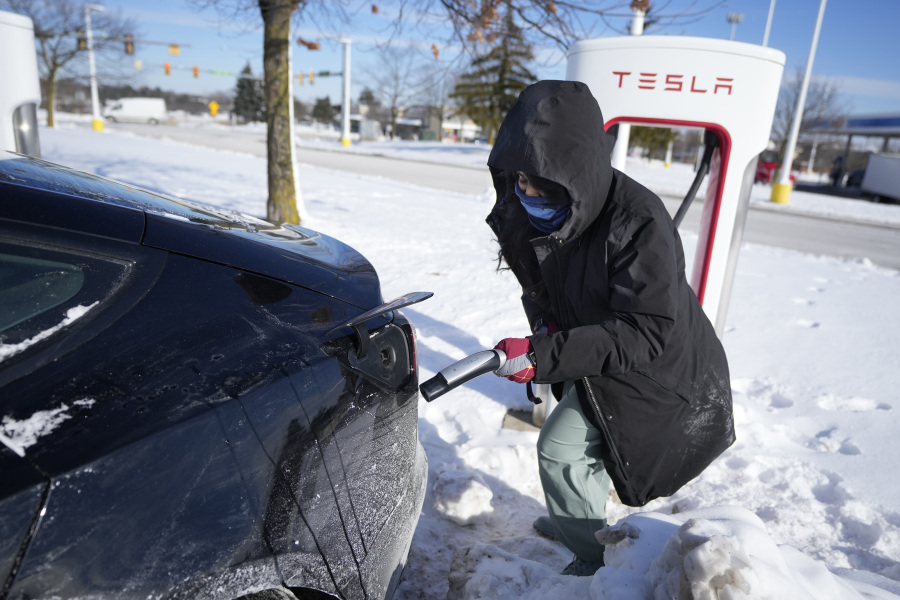 Ankita Bansal prepares to charge her Tesla, Wednesday, Jan. 17, 2024, in Ann Arbor, Mich. A subzero cold snap across the nation has exposed a big vulnerability for electric vehicle owners. It&rsquo;s difficult to charge the batteries in single-digit temperatures.