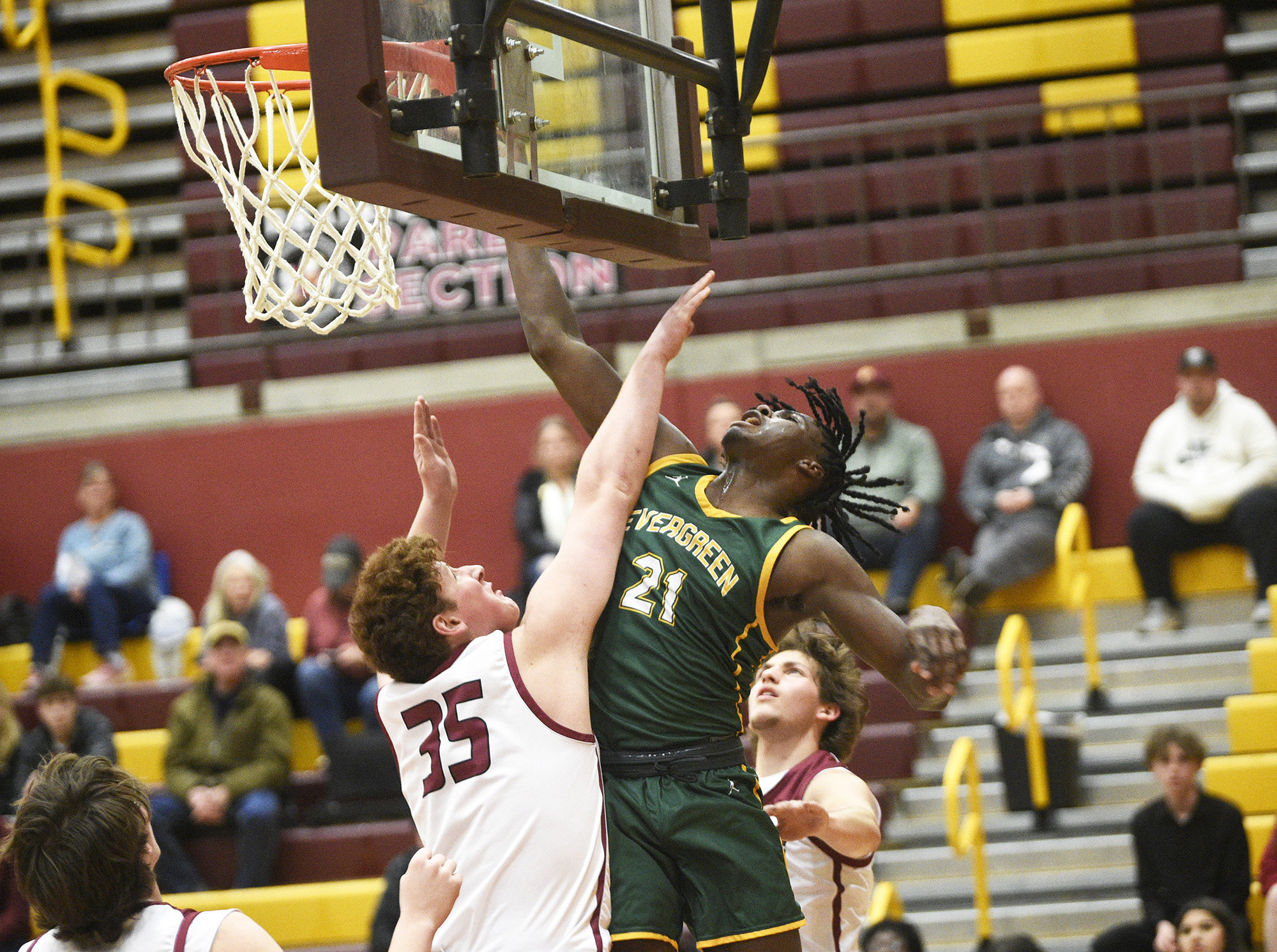 Evergreen senior Arthur Ban (21) takes a shot over Prairie senior Henry Moultrie (35) during a Class 3A Greater St. Helens League boys basketball game at Prairie High School on Tuesday, January 2, 2024.
