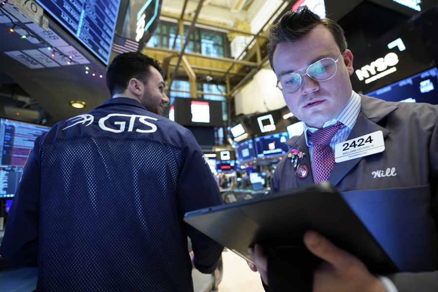 Traders work on the floor at the New York Stock Exchange in New York, Wednesday, Jan. 3, 2024.