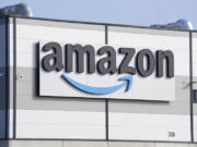 An Amazon company logo is seen on the facade of a company&rsquo;s building in Schoenefeld near Berlin.