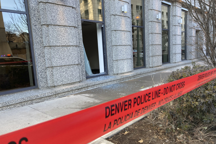 Police tape blocks the damage to large windows at the Colorado Supreme Court on Tuesday, Jan. 2, 2024 in Denver.   Authorities say a man inflicted &ldquo;extensive damage&rdquo; to the building housing.