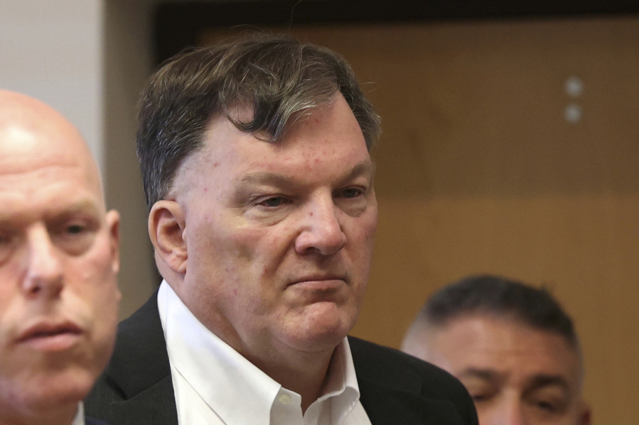 FILE - Rex Heuermann appears with his lawyer Michael J. Brown, left, at Suffolk County Court, Sept. 27, 2023, in Riverhead, N.Y. Long Island prosecutors say they are planning a major announcement in Gilgo Beach serial killing suspect Heuermann&rsquo;s case on Tuesday, Jan. 16, 2024, months after he was charged with murdering three women and was named as the prime suspect in the death of a fourth woman.