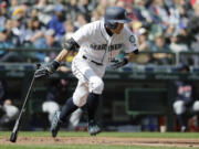 FILE - Seattle Mariners&rsquo; Ichiro Suzuki heads to first base after hitting a single against the Cleveland Indians during the third inning of a baseball game March 31, 2018, in Seattle. Suzuki headlines the group of players who are eligible for Hall of Fame voting a year from now. That ballot is also expected to include Cy Young Award winners CC Sabathia and F&eacute;lix Hern&aacute;ndez &mdash; and the final chance for reliever Billy Wagner, who fell five votes short this time.(AP Photo/Ted S.