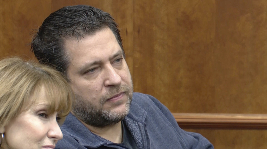 This image taken from video provided by WTVG shows Pastor of Dad&rsquo;s Place Chris Avell, right, sitting inside Bryan Municipal Court on Thursday, Jan. 11, 2024, in Bryan, Ohio. The Christian church filed a federal lawsuit Monday, Jan. 22, after being charged with violating the zoning laws in the northwestern Ohio city by opening up the church around-the-clock for homeless residents and others to find shelter.