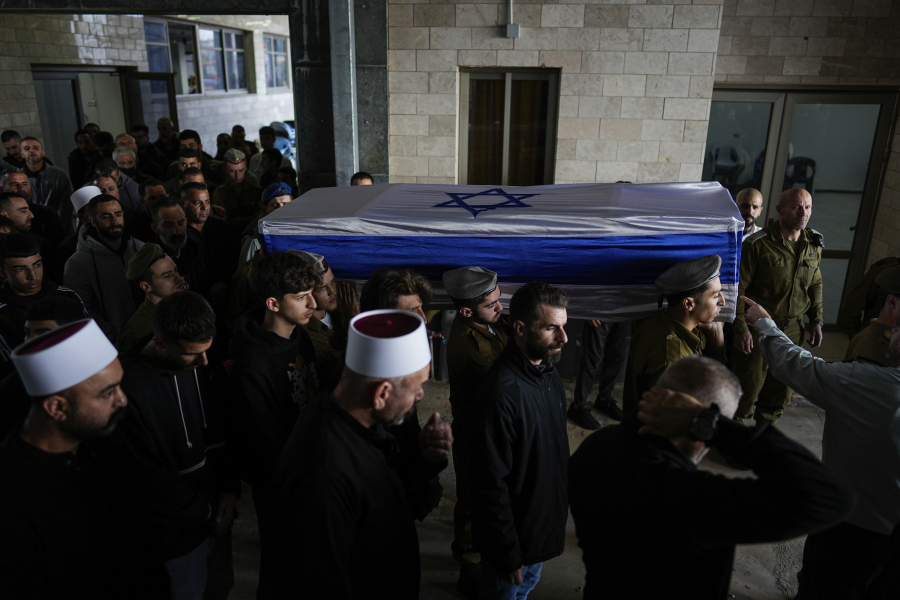 Israeli soldiers carry the flag-draped casket of Staff Sgt. Sufian Dagash during his funeral in the village of Maghar, northern Israel, Wednesday, Jan. 3, 2024. Dagash, 21, a member of the Druze minority, was killed during Israel&rsquo;s ground operation in the Gaza Strip, where the Israeli army has been battling Palestinian militants in the war ignited by Hamas&rsquo; Oct. 7 attack on Israel.