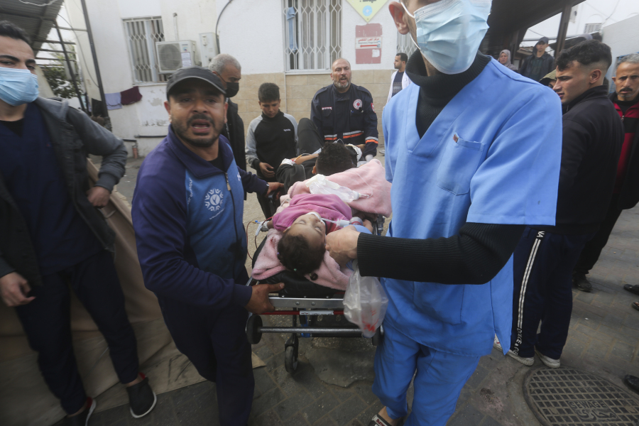 Palestinians wounded during the Israeli air and ground offensive in Khan Younis are brought to a hospital in Rafah, Gaza Strip, Tuesday, Jen. 23, 2024.