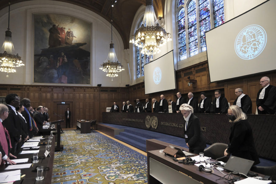 Judges and parties stand Thursday for the opening of the hearings at the International Court of Justice in The Hague, Netherlands, into South Africa&rsquo;s allegation that Israel&rsquo;s war with Hamas amounts to genocide against Palestinians.