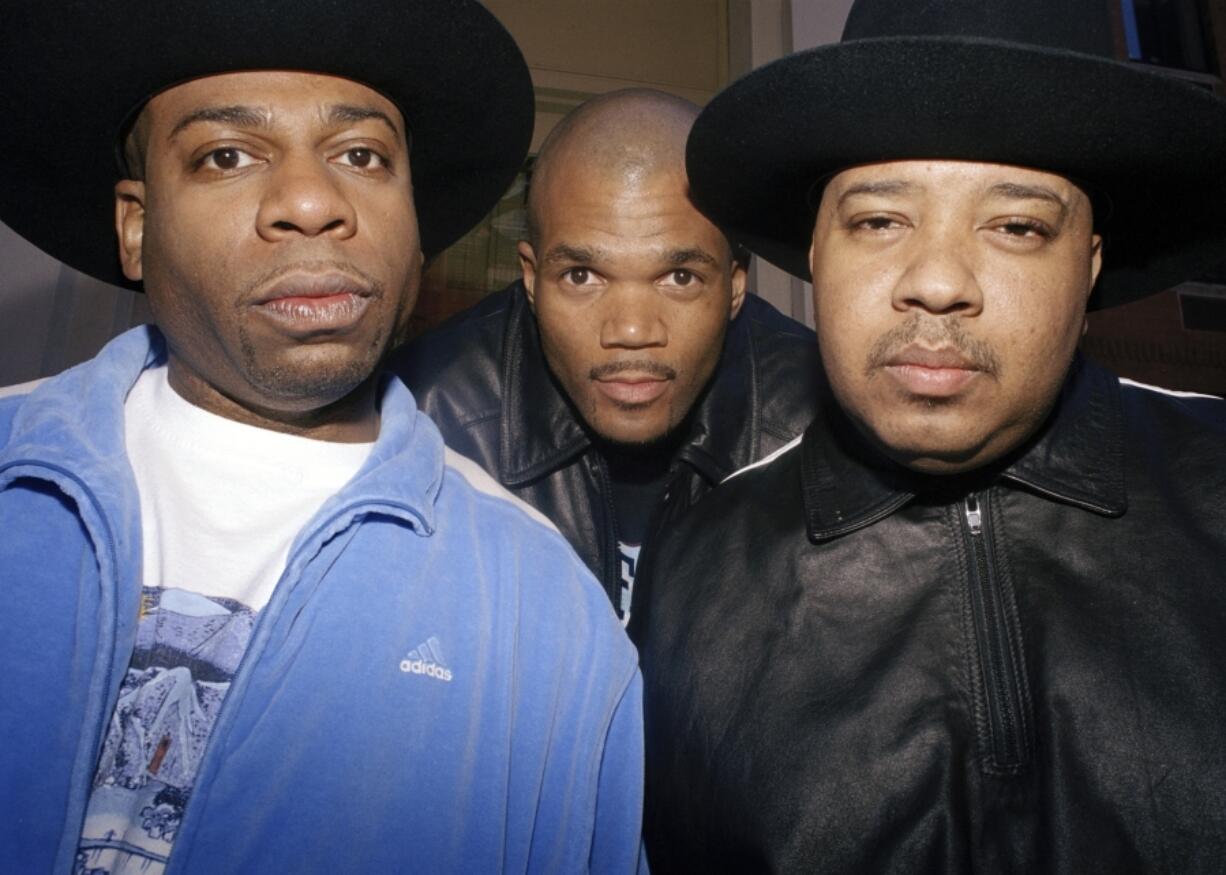 FILE - Rap trio Run-DMC poses in New York, April 5, 2001. From left: Jam Master Jay (Jason Mizell), DMC (Darryl McDaniels) and DJ Run (Joseph Simmons). Opening statements are set for Monday in the federal murder trial of Karl Jordan Jr. and Ronald Washington, who were arrested in 2020 for the murder of Jam Master Jay.