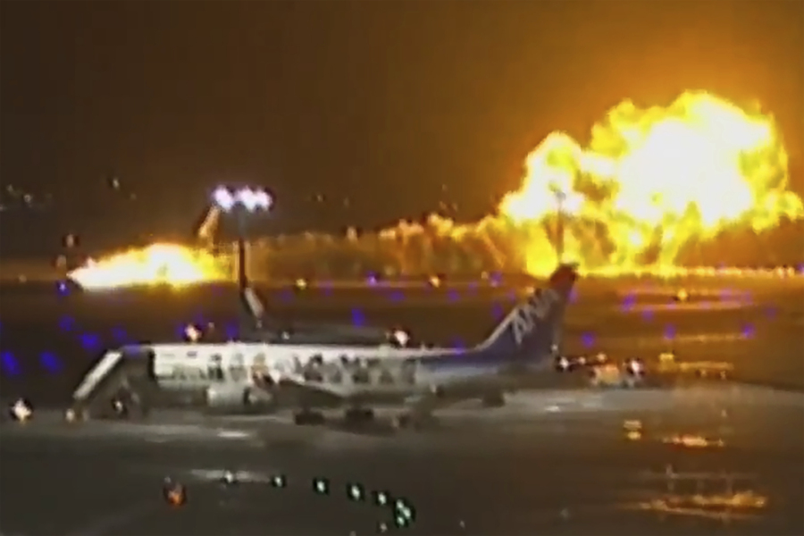 In this image made from video, a Japan Airlines plane is seen on fire on the runway of Haneda airport on Tuesday, Jan. 2, 2024 in Tokyo, Japan. The passenger plane collided with a Japanese coast guard aircraft and burst into flames on the runway of Tokyo&rsquo;s Haneda Airport on Tuesday, officials said.