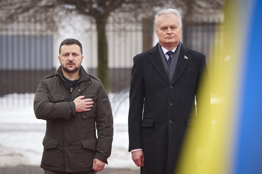 In this photo provided by the Ukrainian Presidential Press Office, Lithuania&rsquo;s President Gitanas Nauseda, right, and Ukrainian President Volodymyr Zelenskyy attend a welcoming ceremony in Presidential Courtyard, Vilnius, Lithuania, Jan. 10, 2024. Volodymyr Zelenskyy is on his trip to Baltic countries that started in Lithuania.