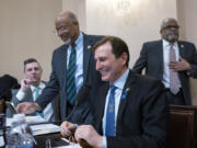 Democratic members of the House Homeland Security Committee, from left, Rep. Seth Magaziner, D-R.I., Rep. Glenn Ivey, D-Md., Rep. Dan Goldman, D-N.Y., and Rep.Troy Carter, D-La., confer during a break as Republicans move to impeach Secretary of Homeland Security Alejandro Mayorkas over the crisis at the U.S.-Mexico border, at the Capitol in Washington, Tuesday, Jan. 30, 2024. (AP Photo/J.