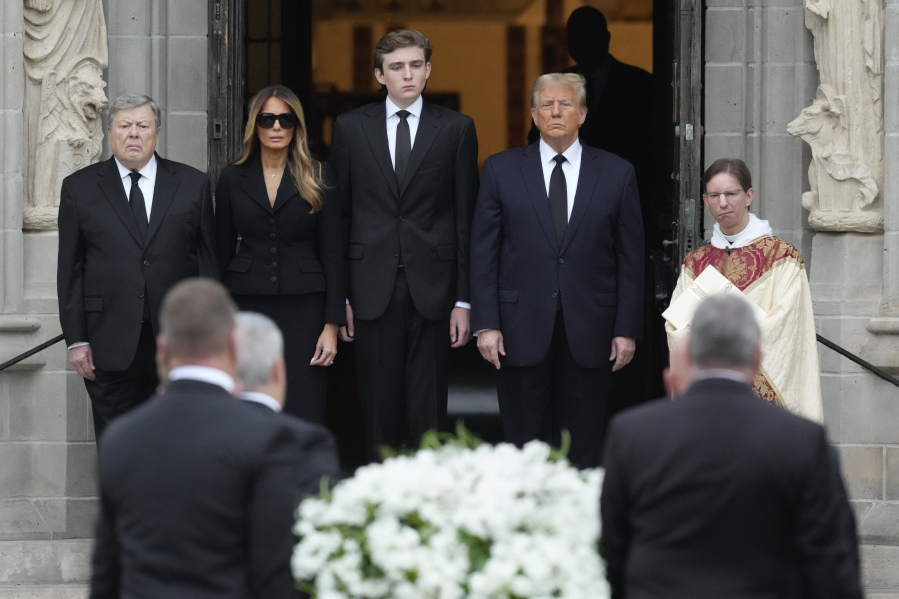 Former President Donald Trump, center right, stands with his wife Melania, second left, their son Barron, center left, and father-in-law Viktor Knavs, as the coffin carrying the remains of Amalija Knavs, the former first lady&rsquo;s mother, is carried into the Church of Bethesda-by-the-Sea for her funeral, in Palm Beach, Fla., Thursday, Jan. 18, 2024.