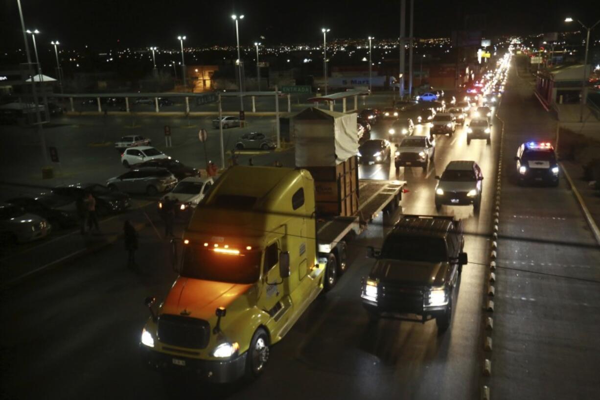 A truck carrying Benito the giraffe is escorted by a convoy of vehicles with officers from the Federal Attorney for Environmental Protection and the National Guard in Ciudad Juarez, Mexico, Sunday, Jan. 21, 2024. After a campaign by environmentalists, Benito left Mexico&rsquo;s northern border and its extreme weather conditions Sunday night and headed for a conservation park in central Mexico, where the climate is more akin to his natural habitat and already a home to other giraffes.