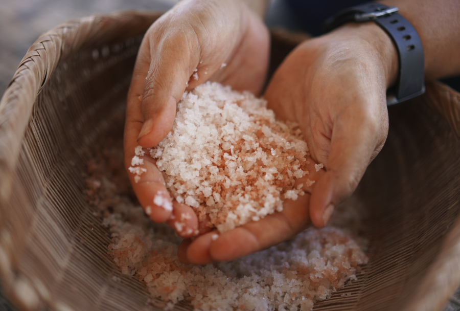 Malia Nobrega-Olivera, a Native Hawaiian salt maker, holds Hawaiian salt, or &ldquo;paakai,&rdquo; on July 10 in Hanapepe, Hawaii.