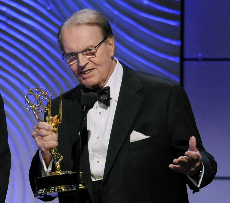 FILE - Charles Osgood accepts the award for outstanding morning program for &quot;CBS Sunday Morning&quot; at the 40th Annual Daytime Emmy Awards on June 16, 2013, in Beverly Hills, Calif.  Osgood, who anchored the popular news magazine&#039;s for more than two decades, was host of the long-running radio program &ldquo;The Osgood File&rdquo; and was referred to as CBS News&rsquo; poet-in-residence, has died. He was 91.