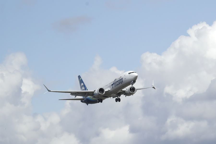FILE - An Alaska Airlines Boeing 737-9 Max flies above Paine Field near Boeing&#039;s manufacturing facility in Everett, Wash., Monday, March 23, 2020, north of Seattle. A window panel blew out on a similar Alaska Airlines Boeing 737-9 Max seven minutes after takeoff from Portland, Ore., on Friday, Jan. 5, 2023. (AP Photo/Ted S.