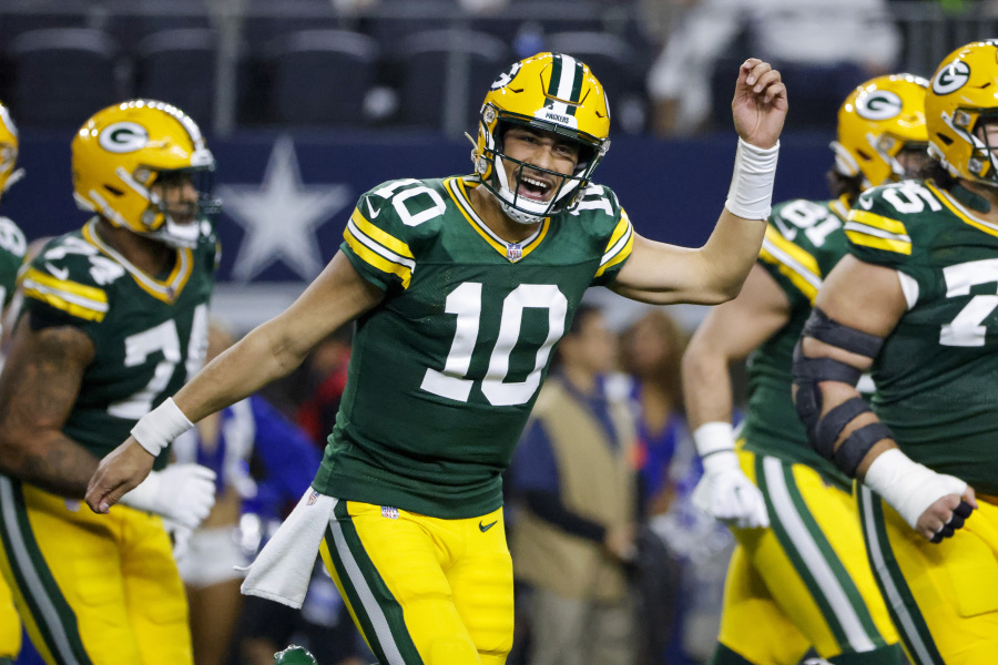 Green Bay Packers quarterback Jordan Love (10) reacts after throwing a touchdown pass against the Dallas Cowboys during the second half of an NFL football game, Sunday, Jan. 14, 2024, in Arlington, Texas.