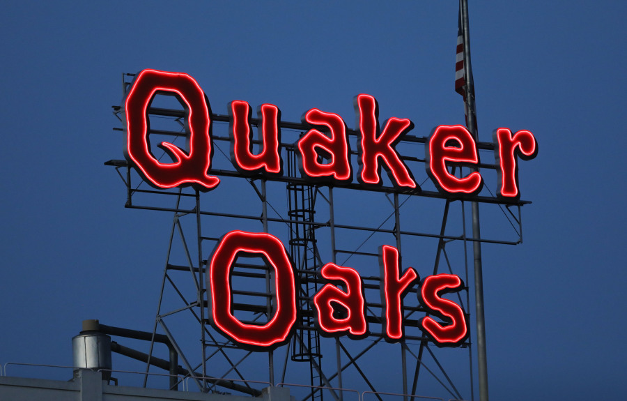 FILE - The Quaker Oats sign is seen in Cedar Rapids, Iowa on Tuesday, June 8, 2021.  The Quaker Oats Company has expanded a December recall of more than 40 products that may be contaminated with salmonella to include two dozen additional types of granola bars, cereals and snack foods, Friday, Jan. 12, 2023.  (Rebecca F.
