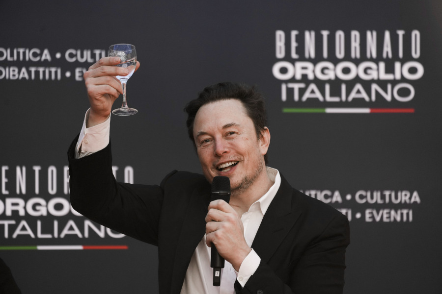 File - Tesla and SpaceX&rsquo;s CEO Elon Musk cheers as he speaks at the annual political festival Atreju, in Rome on Dec. 16, 2023. A recent report from anti-poverty organization Oxfam highlighted how the fortunes of the world&rsquo;s five richest people &mdash; Musk, Amazon founder Jeff Bezos, Oracle cofounder Larry Ellison, Bernard Arnault of luxury company LVMH, and investment guru Warren Buffett &mdash; have more than doubled since 2020.