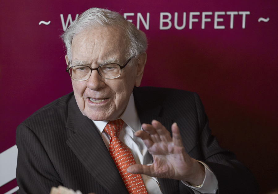 FILE - Warren Buffett, Chairman and CEO of Berkshire Hathaway, speaks during a game of bridge after the annual Berkshire Hathaway shareholders meeting in Omaha, Neb., on May 5, 2019.