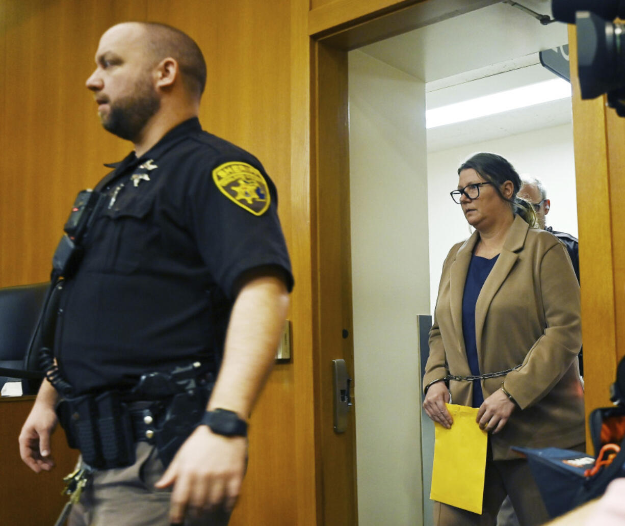 Defendant Jennifer Crumbley enters the courtroom for trial at Oakland County Courthouse, Tuesday, Jan. 30, 2024, in Pontiac, Mich. Crumbley, 45, is charged with involuntary manslaughter. Prosecutors say she and her husband were grossly negligent and could have prevented the four deaths if they had tended to their son&rsquo;s mental health. They&rsquo;re also accused of making a gun accessible at home.