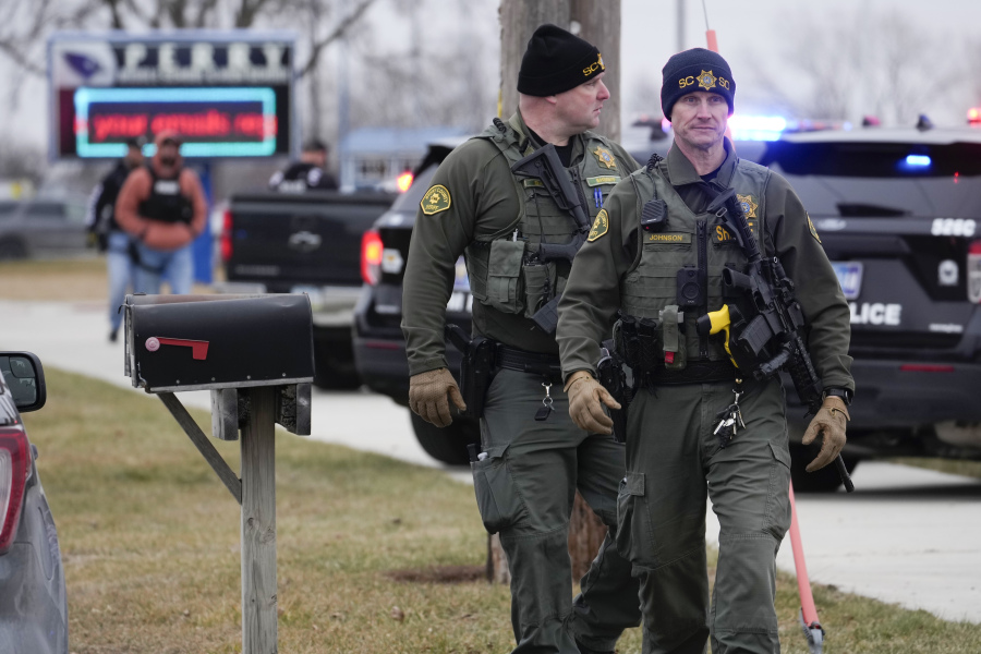 Police respond to Perry High School in Perry, Iowa., Thursday, Jan. 4, 2024.