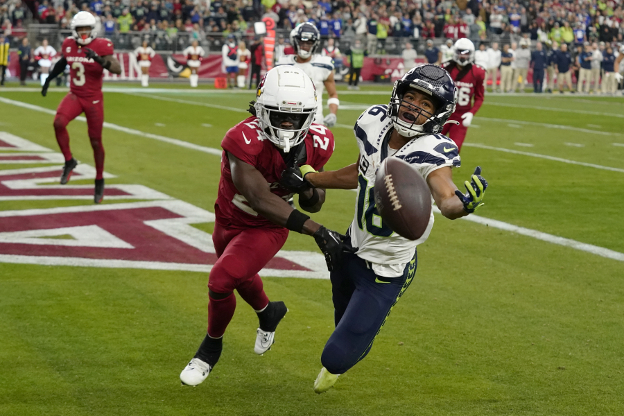 Seattle Seahawks wide receiver Tyler Lockett (16) can&#039;t catch a pass in the end zone as he is defended by Arizona Cardinals cornerback Starling Thomas V (24) in the first half of an NFL football game Sunday, Jan. 7, 2024, in Glendale, Ariz. (AP Photo/Ross D.