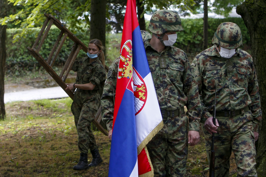 FILE - Serbian Army soldiers prepare for a welcoming ceremony for Serbian President Aleksandar Vucic during COVID-19 vaccination at the army barracks in Belgrade, Serbia, on May 13, 2021. Serbia looks set to reintroduce the obligatory military service for its young citizens, the army command said Thursday, Jan. 4, 2024 in a move that comes amid rising tensions in the Balkans.