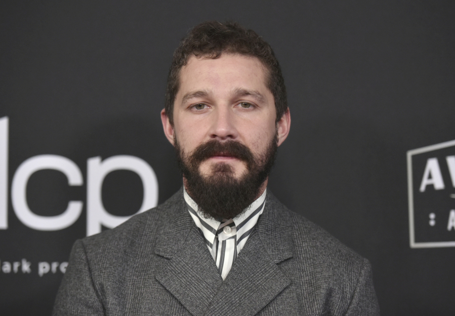 FILE - In this Nov. 3, 2019, file photo, Shia LaBeouf arrives at the 23rd annual Hollywood Film Awards at the Beverly Hilton Hotel in Beverly Hills, Calif. LeBeouf has converted to Catholicism after being confirmed on New Year&rsquo;s Eve at a Mass presided over by Capuchin Franciscan friars. The Capuchin Franciscans-Western American Province announced the news on its Facebook site where it posted images of a smiling LeBeouf receiving Communion, kneeling with his eyes shut in prayer at Mass and hugging friars who attended the ceremony.