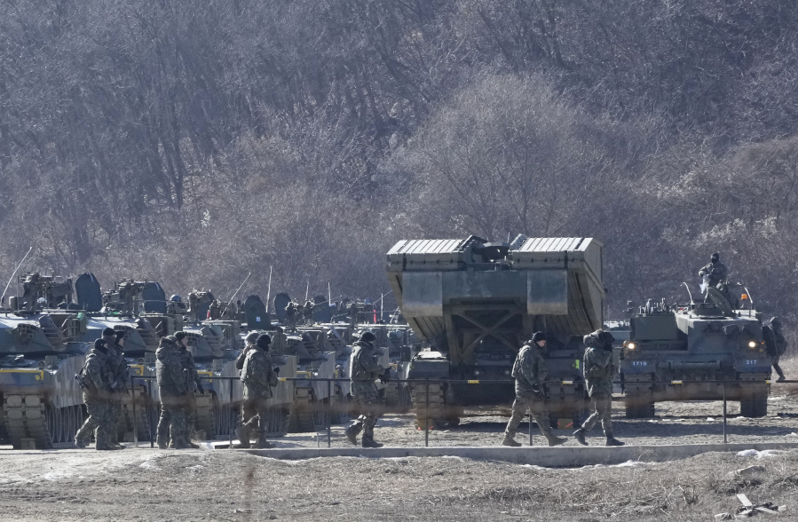 South Korean army soldiers pass by their armored vehicles during a military exercise in Paju, South Korea, near the border with North Korea, Wednesday, Jan. 24, 2024. South Korea&rsquo;s military says North Korea fired several cruise missiles into waters off its western coast, adding to a provocative run of weapons demonstrations in the face of deepening nuclear tensions with the United States, South Korea and Japan.