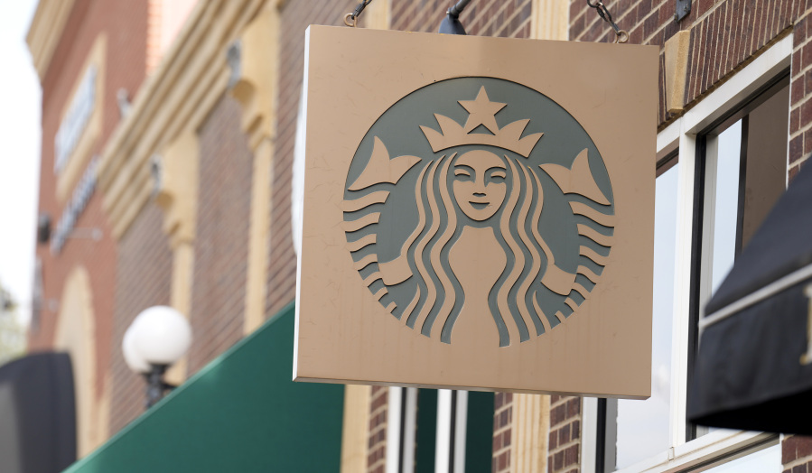 Starbucks sign hangs outside a casino along Main Street Wednesday, Sept. 20, 2023, in Deadwood, S.D. A consumer advocacy group filed a lawsuit against Starbucks on Wednesday, Jan.
