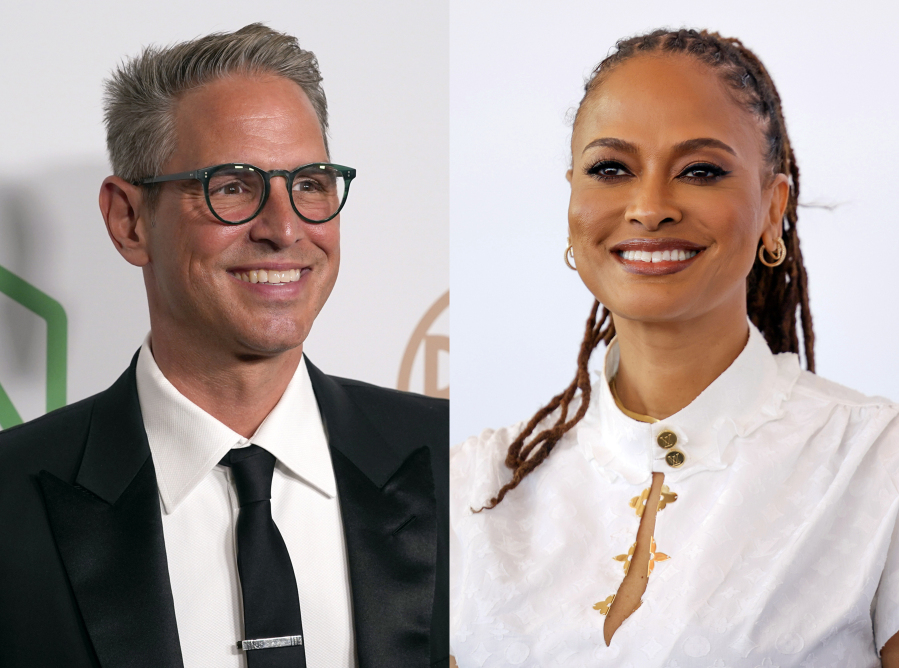 This combination of photos shows Greg Berlanti at the 33rd annual Producers Guild Awards in Los Angeles on March 19, 2022, left, and director Ava Duvernay at the photo call for the film &ldquo;Origin&rdquo; during the 80th edition of the Venice Film Festival in Venice, Italy, on Sept. 6. Berlanti and Duvernay are included on a list that scores them for the diversity and inclusion of the people working both on screen and behind the scenes.