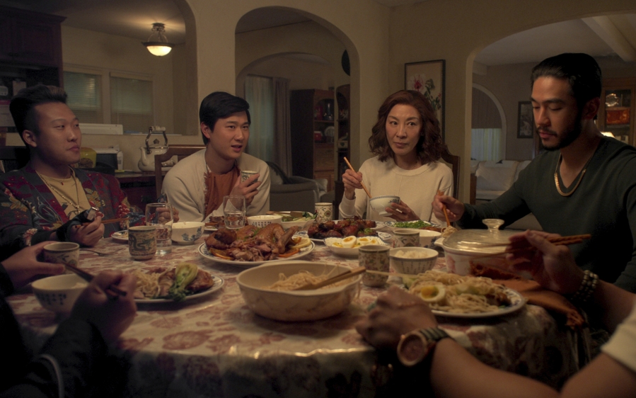 This image released by Netflix shows Joon Lee as TK, Sam Song Li as Bruce Sun, Michelle Yeoh as Mama Sun, Justin Chien as Charles Sun in an episode of &ldquo;The Brothers Sun.&rdquo; (Netflix via AP)