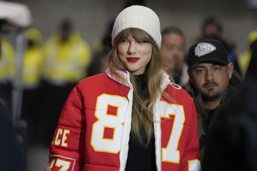 FILE - Taylor Swift wears a Kansas City Chiefs tight end Travis Kelce jacket as she arrives before an NFL wild-card playoff football game between the Chiefs and the Miami Dolphins, Saturday, Jan. 13, 2024, in Kansas City, Mo. A scourge of pornographic deepfake images generated by artificial intelligence and sexualizing people without their consent has hit its most famous victim, singer Taylor Swift, drawing attention to a problem that tech platforms and anti-abuse groups have struggled to solve.