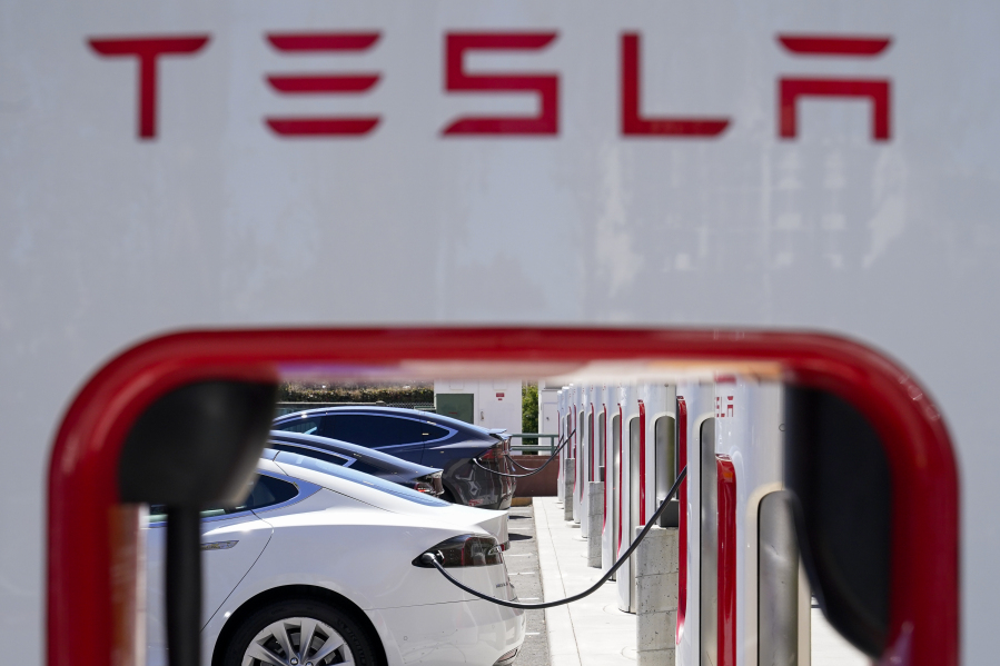 Tesla 4Q earnings fall short of analyst estimates as company warns of