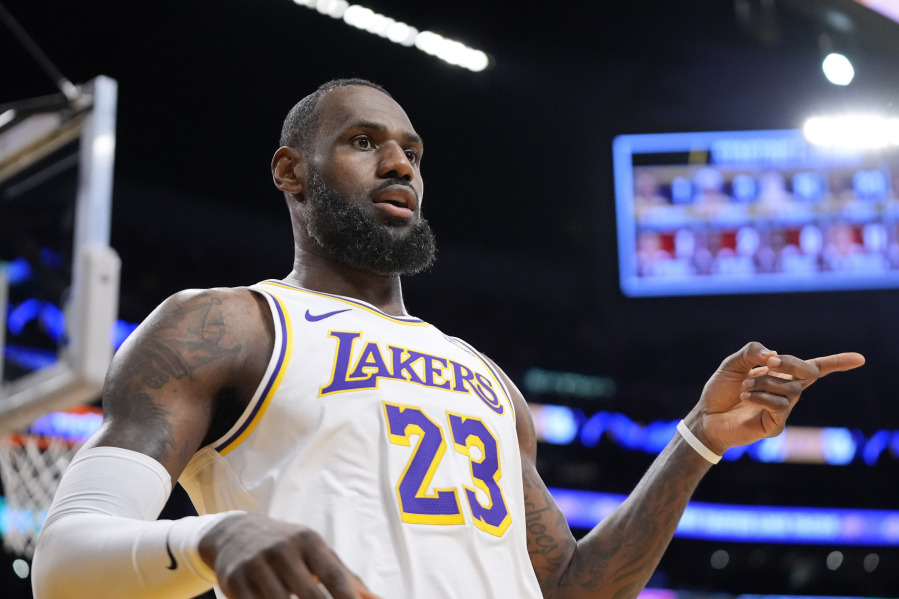 Los Angeles Lakers forward LeBron James gestures after scoring during the first half of an NBA basketball game against the Portland Trail Blazers Sunday, Jan. 21, 2024, in Los Angeles. (AP Photo/Mark J.